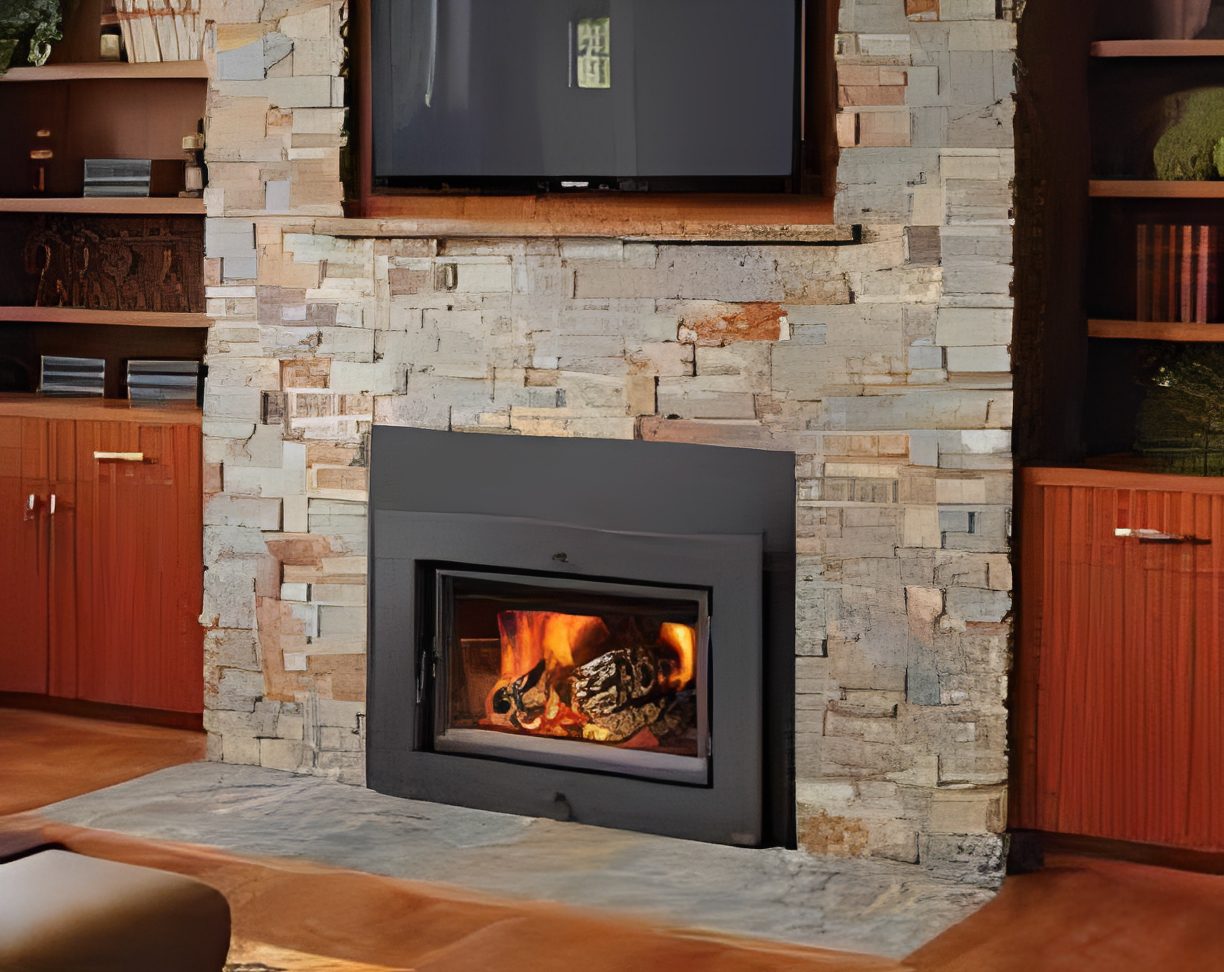 Modern fireplace with stone surround and fire.